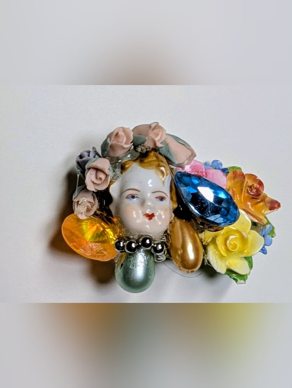 Wendy Gell pin porcelain face with porcelain flowers jewels pearls